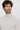 Man wearing a light beige basic turtleneck sweater, relaxed fit, against white background