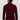 Back view of man wearing burgundy turtleneck sweater and beige trousers