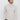 Man wearing light beige turtleneck sweater with long sleeves and relaxed fit, casual style