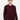 Man wearing a burgundy crew neck sweater with relaxed fit and beige trousers