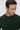 Man wearing a dark green crew neck sweater, relaxed fit, against a light background
