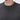 Close-up of a man wearing a dark grey crew neck knit sweater, relaxed fit