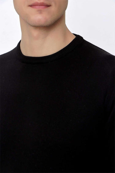 Men's black crew neck knit sweater, relaxed fit, close-up on chest and collar