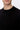 Men's black crew neck knit sweater, relaxed fit, close-up on chest and collar