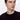 Man wearing a black crew neck knit sweater, relaxed fit, close-up studio shot