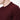 Close-up of a man wearing a burgundy crew neck knit sweater, relaxed fit.