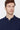 Man wearing a navy blue polo shirt with button placket, relaxed fit, on white background