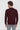 Man wearing maroon long sleeve polo shirt with relaxed fit, seen from the back