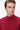 Man wearing a red slim fit turtleneck sweater against a white background