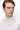 Man wearing light beige mock neck sweater, close-up with plain background