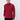Man wearing a red long sleeve turtleneck sweater and black trousers on plain background