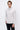 Men's light grey mock neck sweater, relaxed fit, paired with black jeans