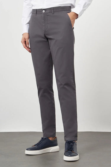 Men's anthracite cotton slim-fit trousers with side pockets, styled with sneakers