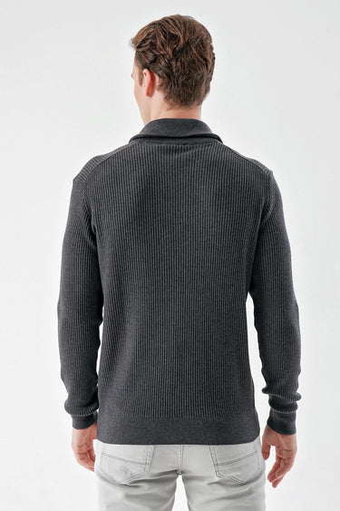 Man wearing a dark grey ribbed knit sweater with long sleeves, shown from the back