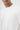 Close-up of man wearing plain white crew neck basic t-shirt on white background