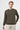 Man wearing khaki crew neck long sleeve sweatshirt and light pants on white background
