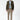 Man wearing olive green slim fit blazer, light blue shirt, beige slim trousers and sneakers