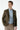 Man wearing khaki slim fit woven blazer, light blue shirt, and beige trousers