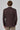Back view of man wearing brown check patterned knit blazer