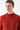 Man wearing a plain red half turtleneck sweater, closeup on upper body