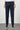 Slim fit men's navy cotton trousers with side pockets and casual sneakers