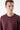 Man wearing a plain burgundy crew neck sweatshirt on a white background