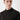 Man wearing a black basic half turtleneck sweater against a light background