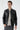 Man wearing black faux leather bomber jacket with zip front and ribbed cuffs