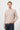 Man wearing taupe basic crew neck sweater and dark jeans, casual fashion style