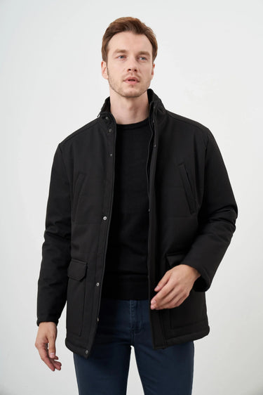 Man wearing a black snap-button casual jacket with front pockets, styled with jeans